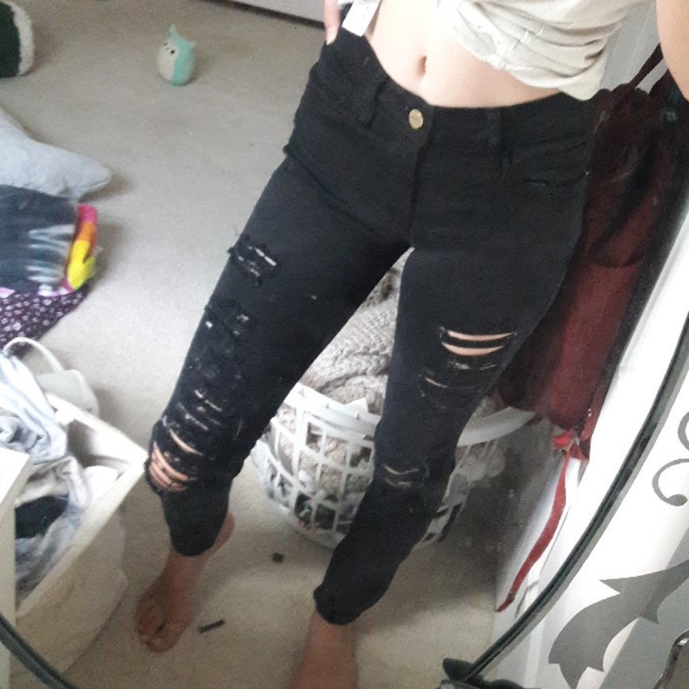 Mid -low rise black ripped jeans